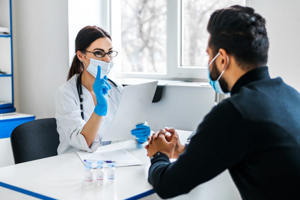 female-doctor-consults-her-patient-holds-documents-her-hands